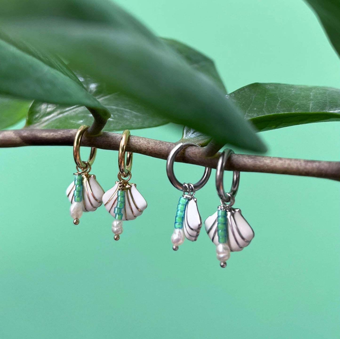 JF BLOSSOM OORBELLEN SCHELP ZILVER